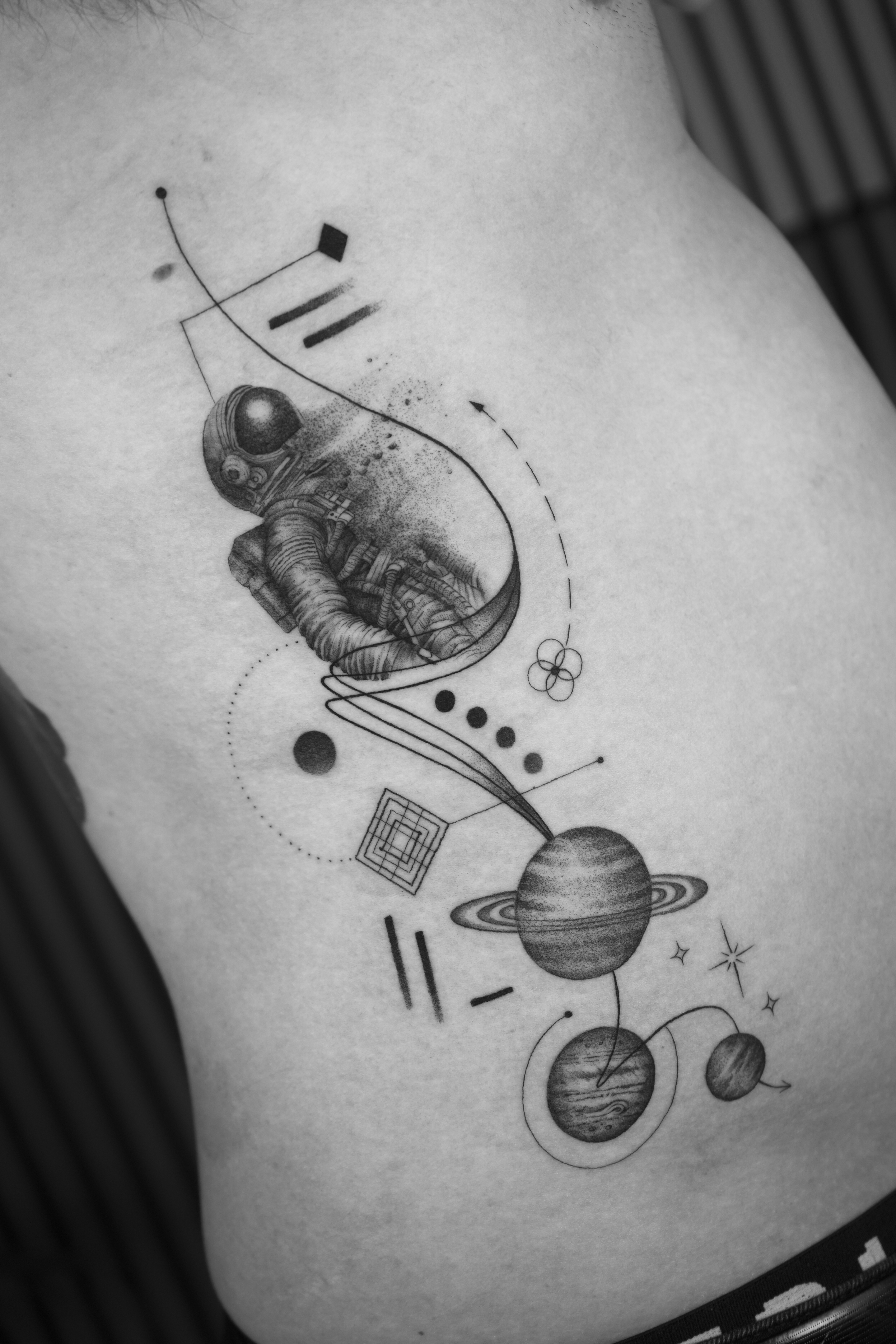 Astronaut rib piece with planets